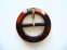 38-1 One of several mock tortoiseshell belt buckles